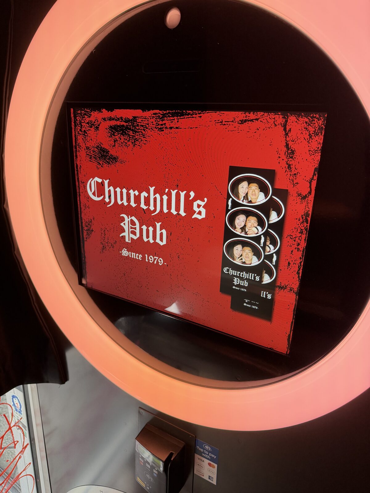 Illuminated Churchill's Pub mirror booth screen