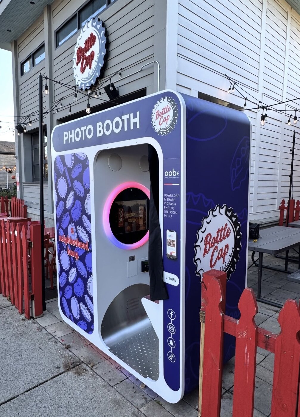Bottle Cap photo booth installed outdoors on a patio